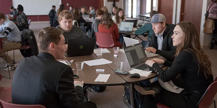 A group of business students sitting at a table